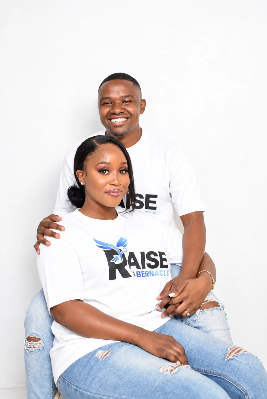 Ishmael and Princess Mbongwana, co-planters of Raise Tabernacle, wearing Raise Tabernacle T-shirts