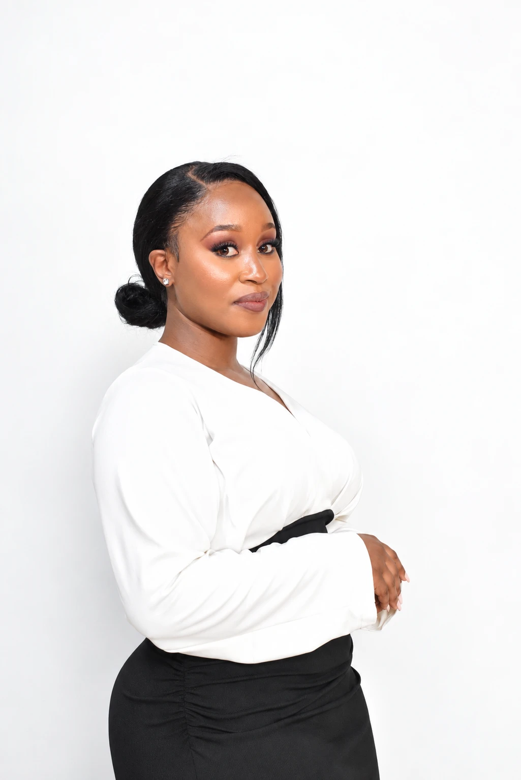 Princess Mbongwana in a white blouse and black skirt