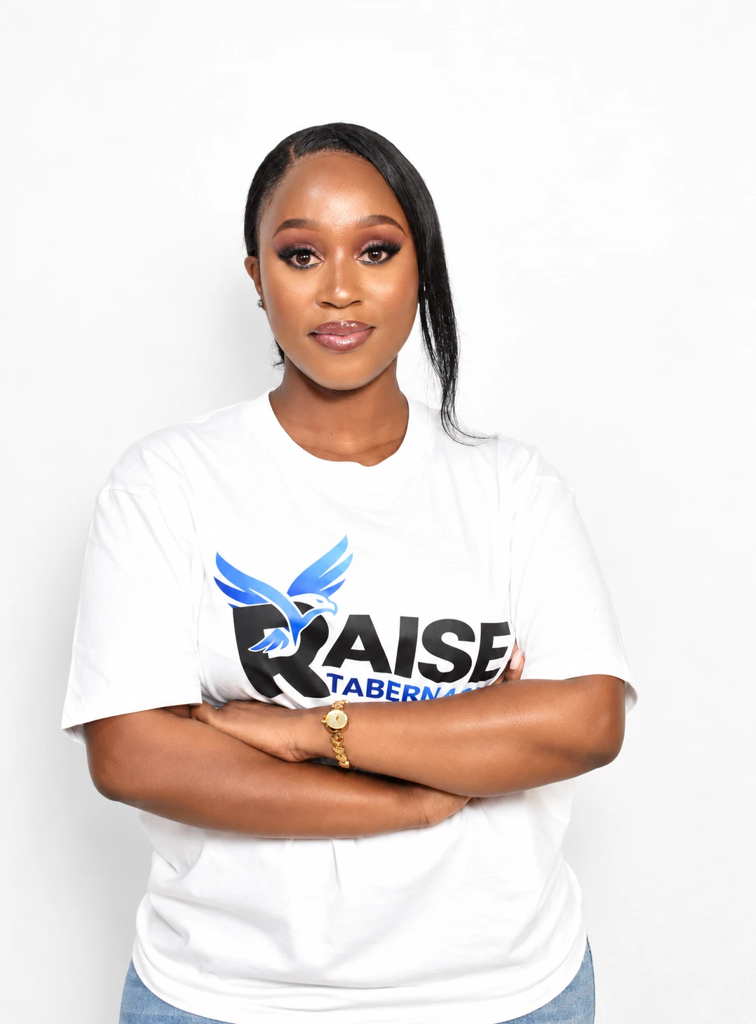Princess Mbongwana wearing a Raise Tabernacle T-shirt